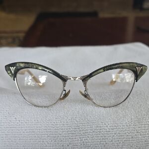 Vintage Cat-Eye Glasses with Gold and Black Accents.